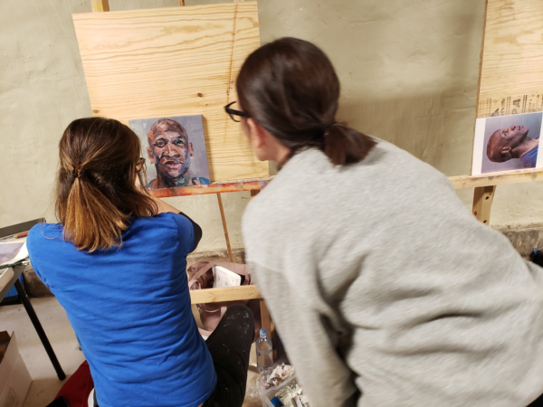 August 2024, Alyssa Monks critiquing Deb's painting "AM" at Wausau Museum of Contemporary Art in Downtown Wausau, WI. *Photo credit: Beau and Kara Lasiewicz August 2024, Alyssa Monks critiquing Deb's painting "AM" at Wausau Museum of Contemporary Art in Downtown Wausau, WI. *Photo credit: Beau and Kara Lasiewicz