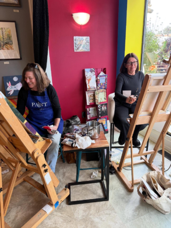 August 2025 Deb Maccagnano and Renee painting at Rise Up for the Arts Festival in Downtown Wausau, WI. *Photo credit: Rise Up August 2025 Deb Maccagnano and Renee painting at Rise Up for the Arts Festival in Downtown Wausau, WI. *Photo credit: Rise Up